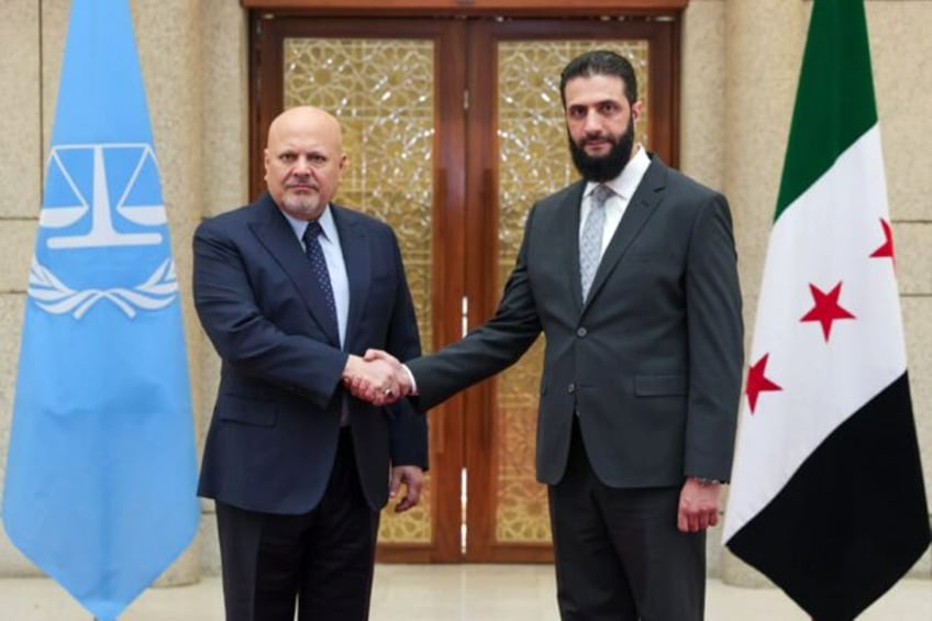 International Criminal Court chief prosecutor Karim Khan (L) meets Syria's new leader Ahme