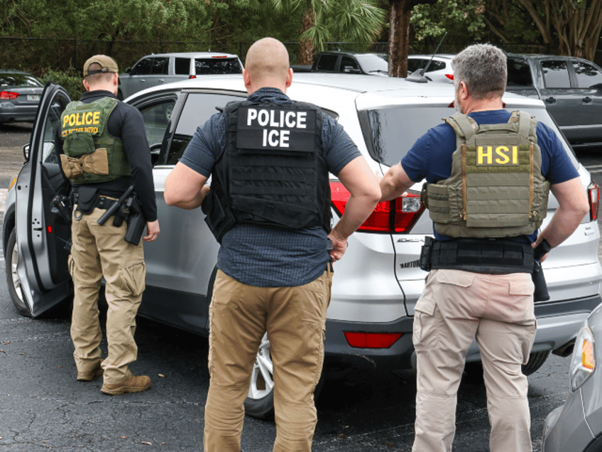 ICE officers, with assistance from Homeland Security Investigations and Border Patrol perf