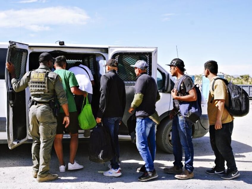 JACUMBA HOT SPRINGS, CALIFORNIA - JUNE 9: Migrants are processed by the US Border Patrol a