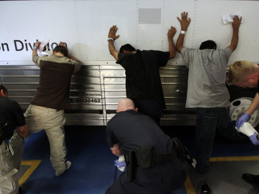 Undocumented immigrants are searched while being in-processed at the Immigration and Custo