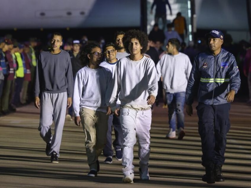 Deported individuals from the US arrive on a flight at Simon Bolivar International Airport