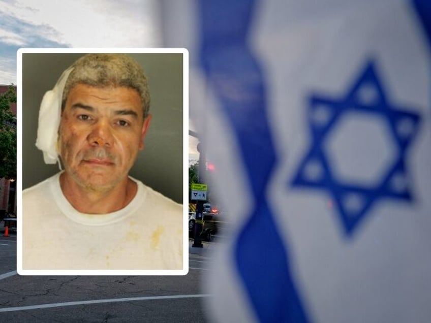 An Israeli flag is fixed to a street sign as police stand by off Pearl Street on the scene