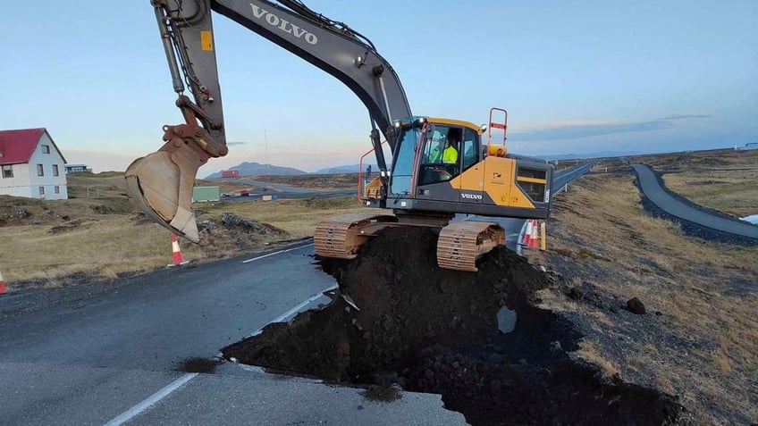 iceland dispatches bulldozer to build volcano defenses as fears persist of imminent eruption