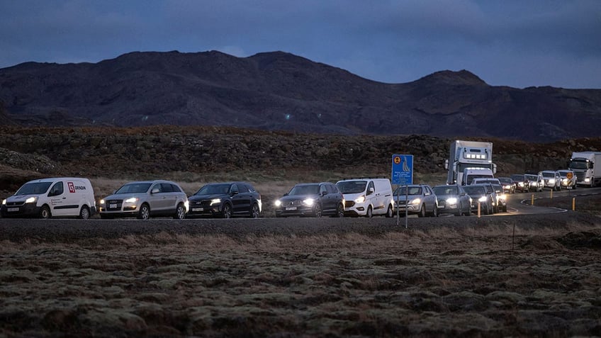 iceland dispatches bulldozer to build volcano defenses as fears persist of imminent eruption