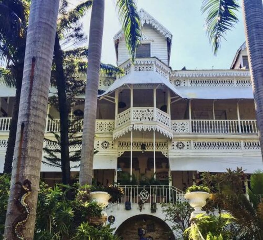 iconic port au prince hotel that hosted kennedys mick jagger burns down during gang war