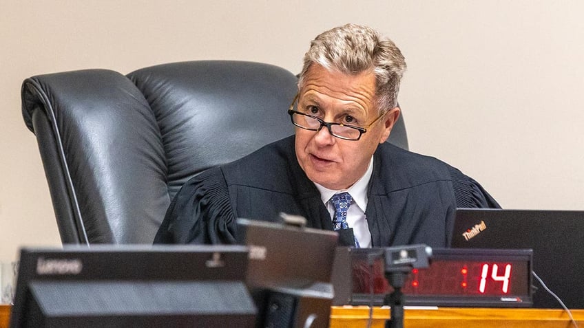 Judge John Judge speaks from his seat in the Latah County District Court