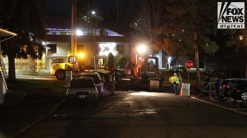 Construction vehicles demolishing the Idaho home.