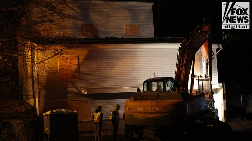 Construction vehicles demolishing the Idaho home.