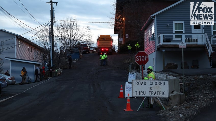 Construction vehicles demolishing the Idaho home.