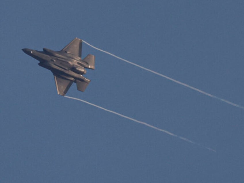 This picture taken from northern Israel shows an Israeli Air Force fighter jet flying over