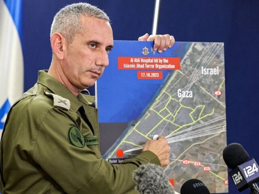 TOPSHOT - Israeli army spokesman Rear Admiral Daniel Hagari speaks to the press from The Kirya, which houses the Israeli Ministry of Defence, in Tel Aviv on October 18, 2023. A blast ripped through a hospital in war-torn Gaza killing hundreds of people late on October 17, sparking global condemnation …