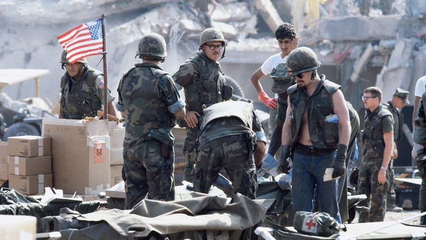 U.S. Marines search for survivors and bodies in the rubble, all that was left of their barracks headquarters in Beirut on Oct. 24, 1983, after a terrorist suicide car bomb was driven into the building and detonated, killing 241 U.S. service members and wounding over 60.