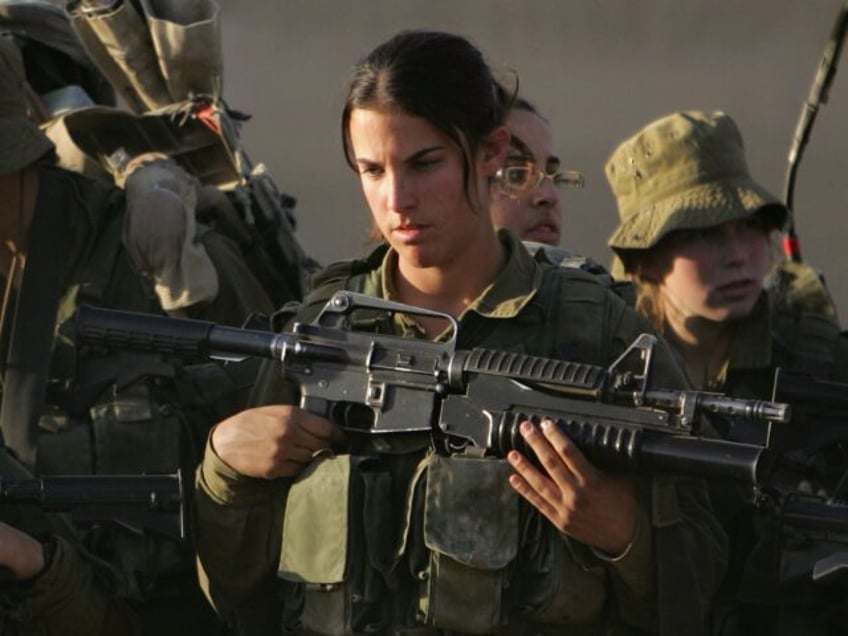 FILE - In this Dec. 20, 2006, file photo Israeli soldiers listen to their commander as the