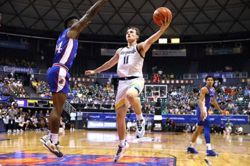 ighodaro leads no 4 marquette to 73 59 rout of top ranked kansas in testy maui semifinal