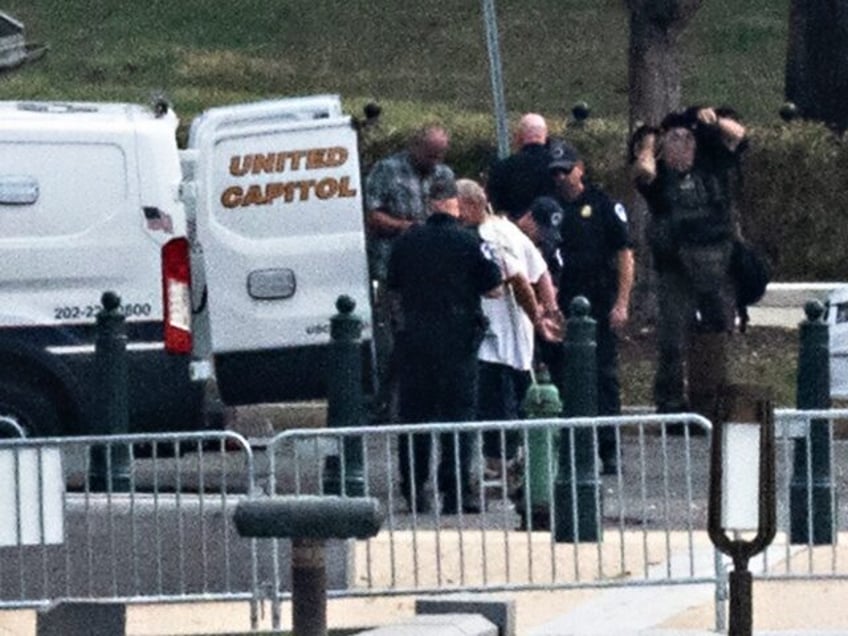 US Capitol Police arrest a suspect who parked a vehicle outside Supreme Court in Washington, DC, on October 5, 2021. - Police identified the man as Dale Paul Melvin, 55, of Kimball, Michigan. (Photo by Jim WATSON / AFP) (Photo by JIM WATSON/AFP via Getty Images)