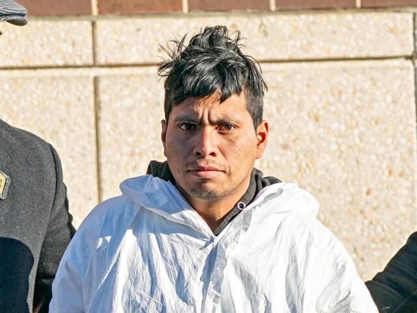 Sebastian Zapeta, suspected of burning a woman to death on a train, is taken from the NYPD