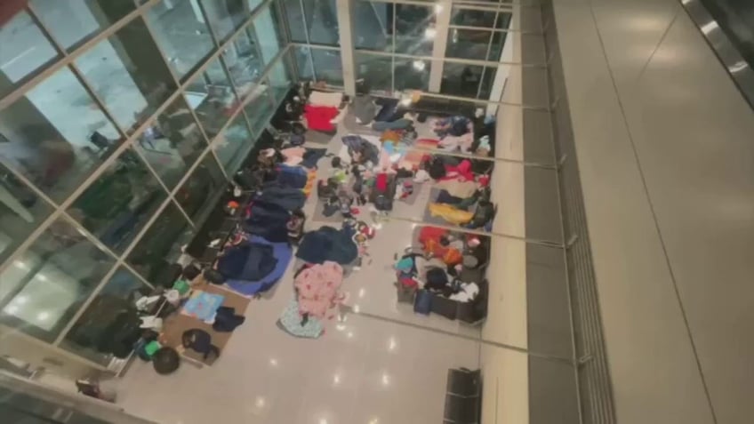 migrants at Logan Airport seen from above