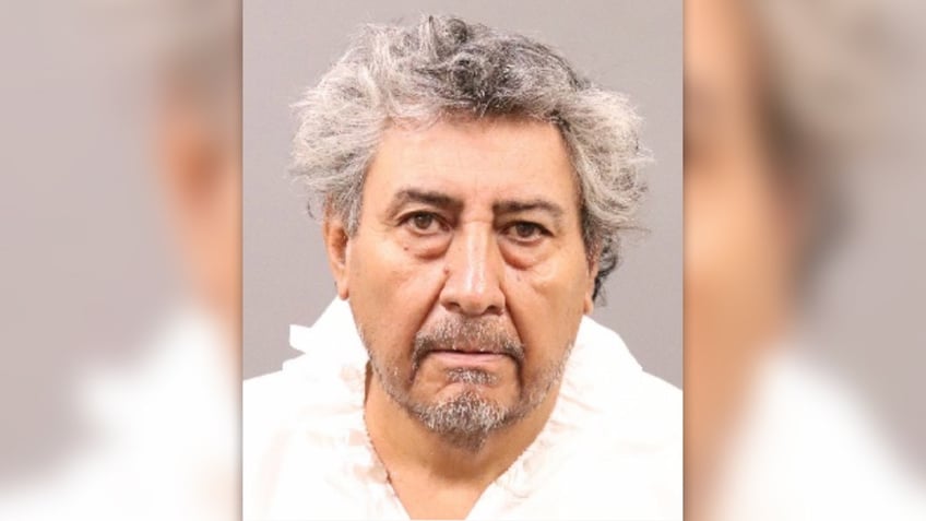 Jose Carmen Cardona, unkempt gray hair, goatee and white shirt