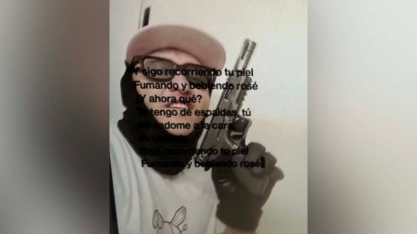 Diego ibarra poses with handgun and mask