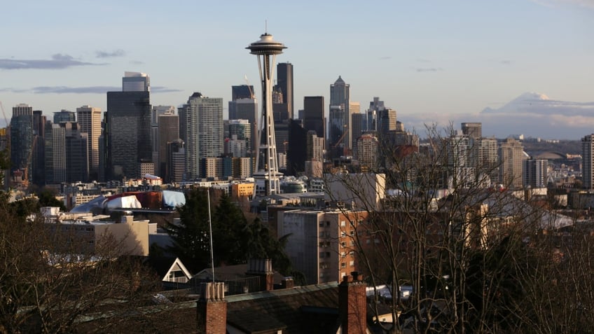 Space Needle at center of aerial shot of Seattle skyline