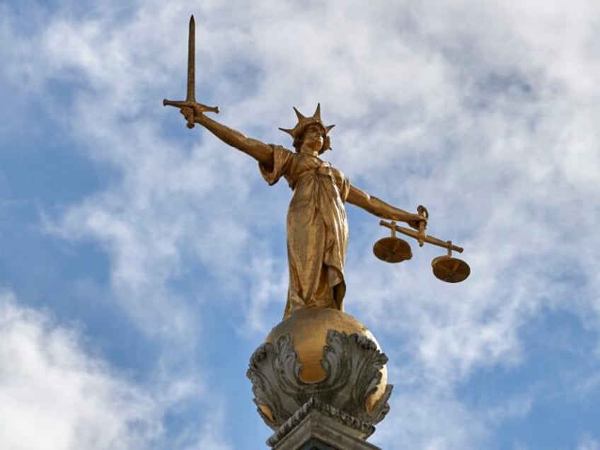 The "Lady of Justice", a 12 foot high, gold leaf statue is pictured on top of the dome of