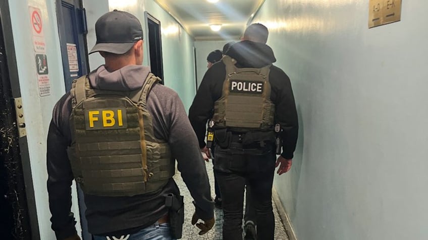 Officers from the FBI conduct immigration enforcement in New York