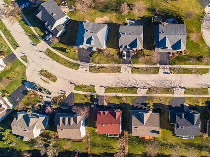 Top view directly above drone aerial view of the street in the residential neighborhood Libertyville, Vernon Hills, Chicago, Illinois.