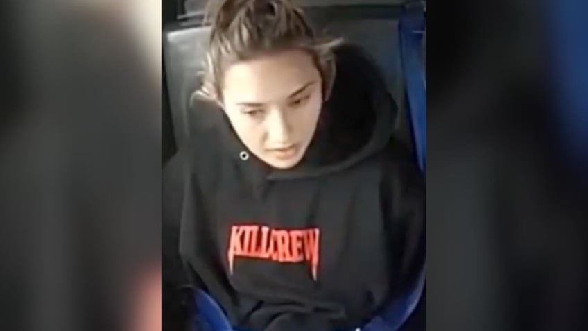 Christina formella in a police car