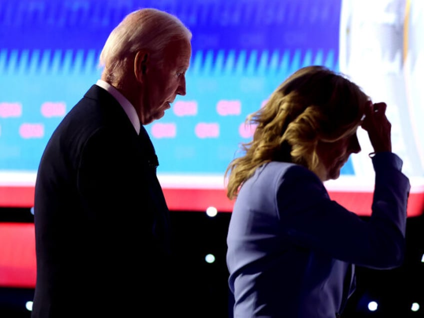 ATLANTA, GEORGIA - JUNE 27: U.S. President Joe Biden walks off with first lady Jill Biden