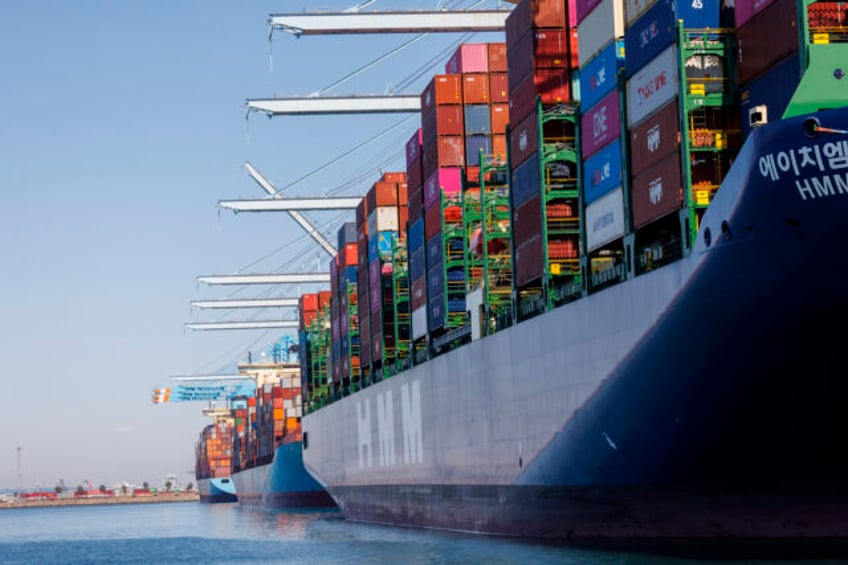 LOS ANGELES, CA - MAY 9, 202: Three container ships are among the few unloaded and loaded