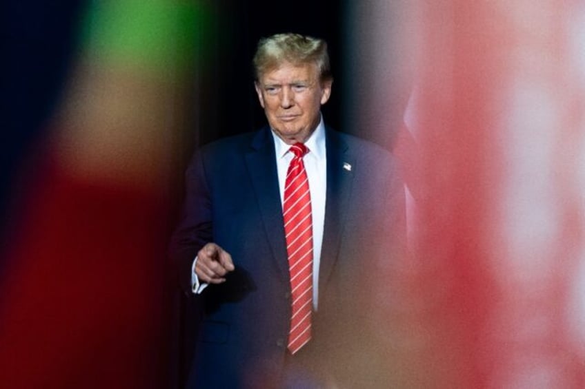 Former US President Donald Trump arrives for a campaign event in Rome, Georgia, on March 9