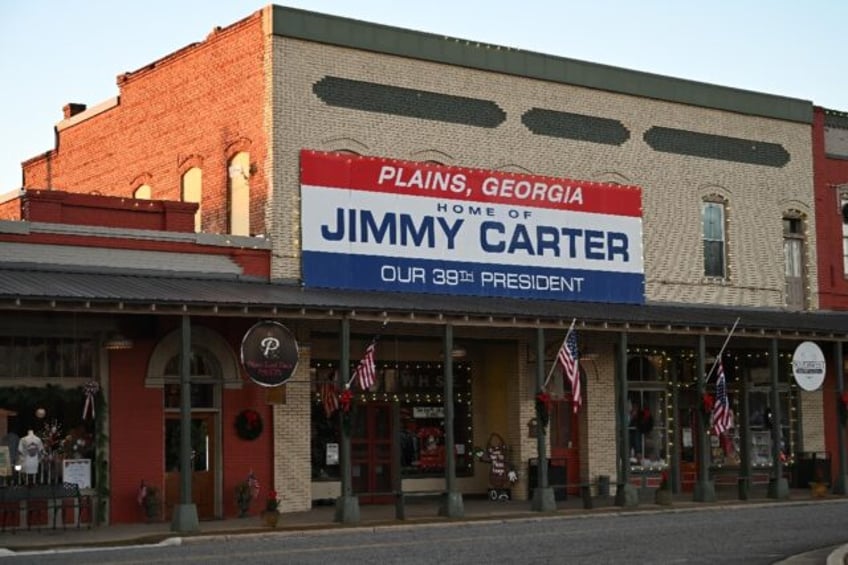 A sign has long hung in downtown Plains, Georgia heralding Jimmy Carter as the 39th presid