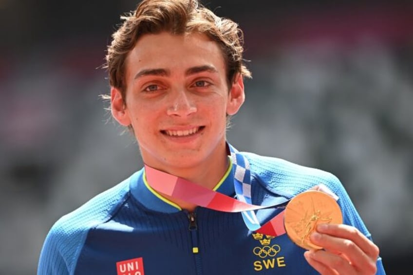 Olympic pole vault champion Armand Duplantis, pictured with his gold medal from the 2020 T