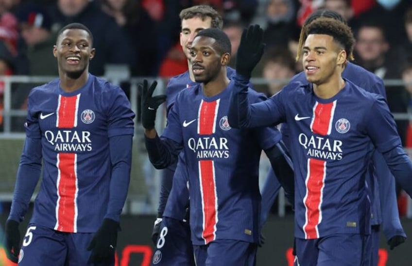 Ousmane Dembele (C) celebrates after scoring another hat-trick as Paris Saint-Germain beat