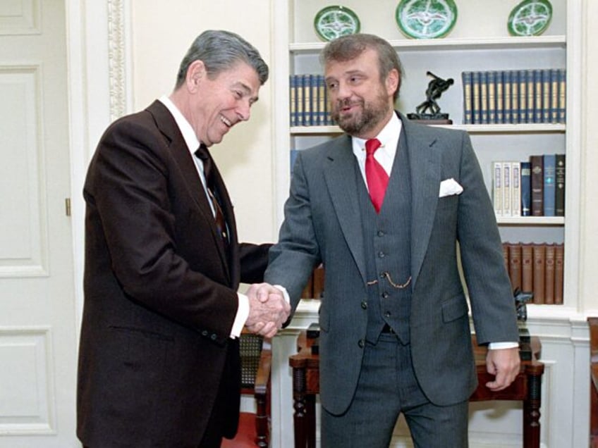 President Reagan during a photo op with Tony Dolan. (Photo by: HUM Images/Universal Images