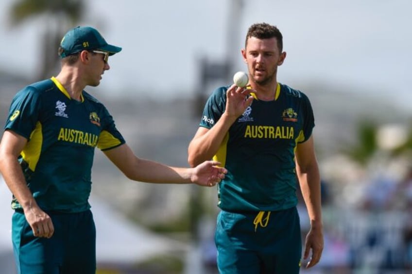 'Best interest' to see England exit: Australia's Josh Hazlewood (R) with Pat Cummins durin