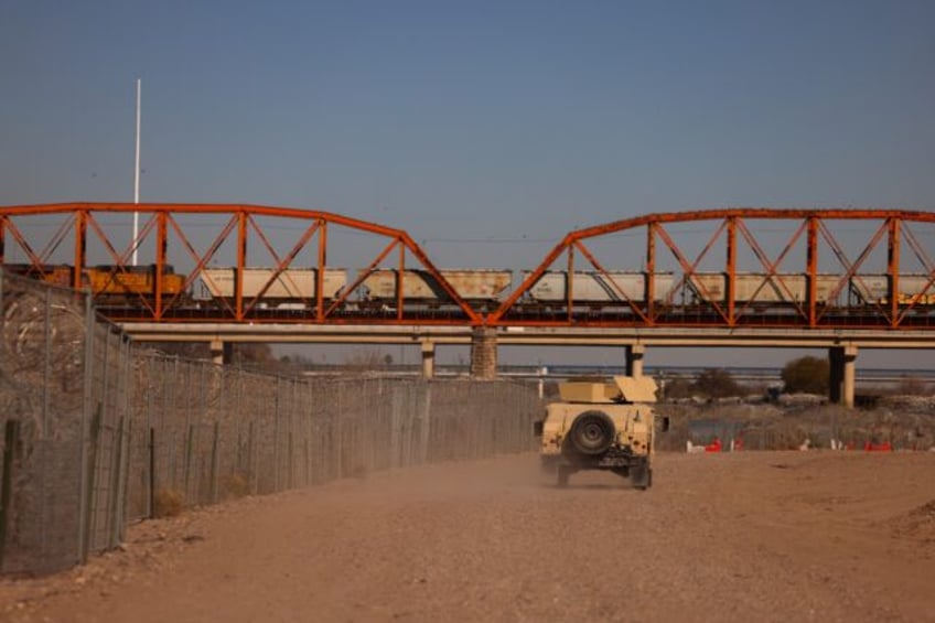 A US Army armored vehicle patrols the US-Mexico border in Eagle Pass, Texas, on January 24