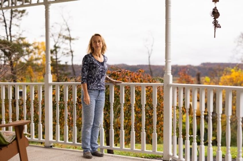 Point Township resident Annmarie Weber stands on the porch of her Pennsylvania home which overlooks land where a chemical recycling plant is proposed