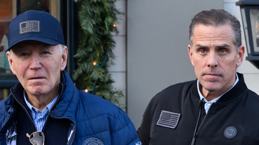 Joe Biden in blue ball cap with son Hunter
