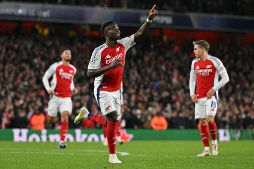 Arsenal's Bukayo Saka celebrates scoring against Monaco