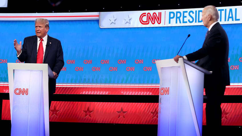 U.S. President Joe Biden (R) and Republican presidential candidate, former U.S. President Donald Trump participate in the CNN Presidential Debate at the CNN Studios on June 27, 2024 in Atlanta, Georgia. 