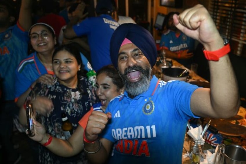 Fans celebrate after India wins the ICC Men's T20 World Cup final cricket match against So