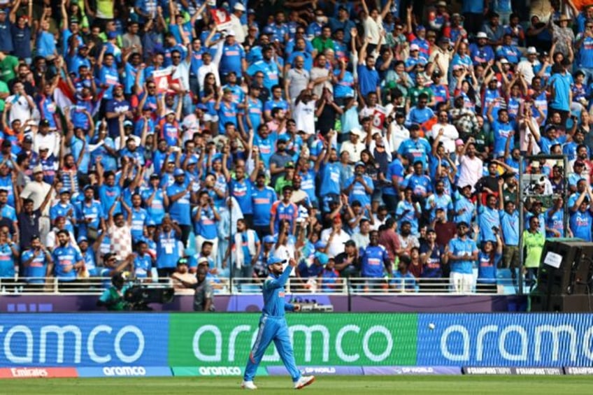 India's Virat Kohli catches Pakistan batter Khushdil Shah during the Champions Trophy matc