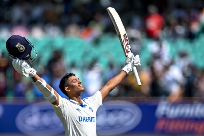 India's Yashasvi Jaiswal celebrates after scoring a double century during the fourth day o