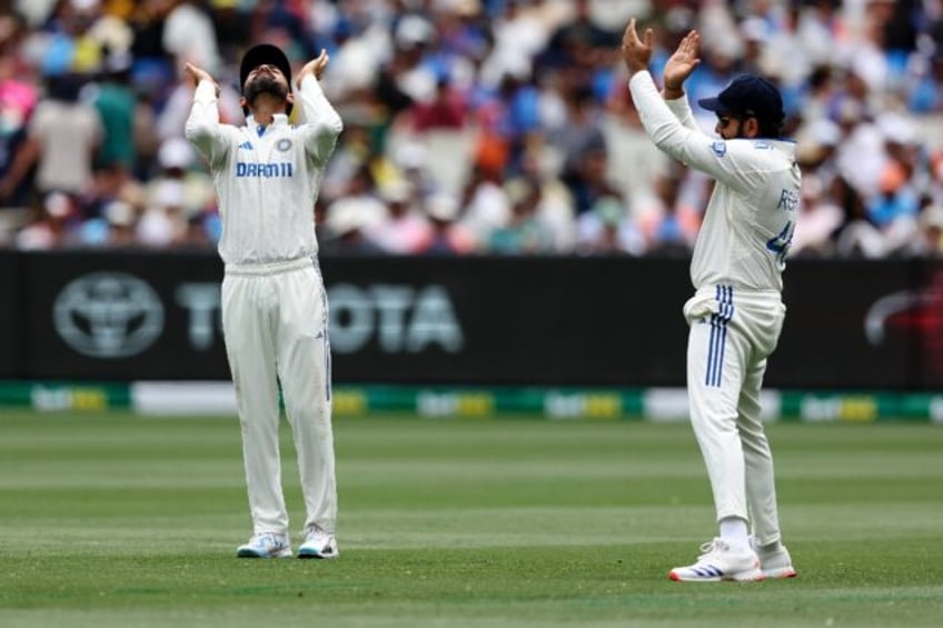 India's Virat Kohli (L) and Rohit Sharma during the fourth Test in Melbourne