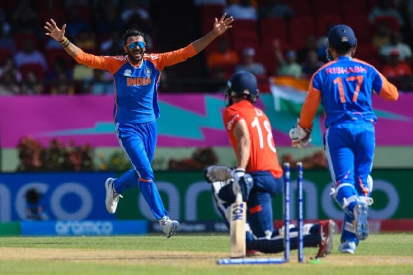 In the wickets: India's Axar Patel celebrates his dismissal of Moeen Ali