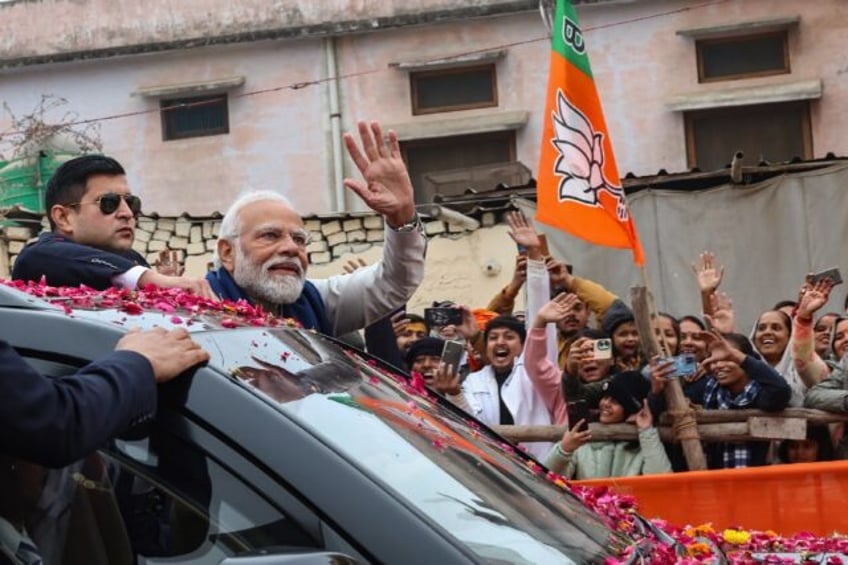 Indian Prime Minister Narendra Modi visited a holy town to open fresh transport links catering to pilgrims for a new temple steeped in a history of sectarian violence