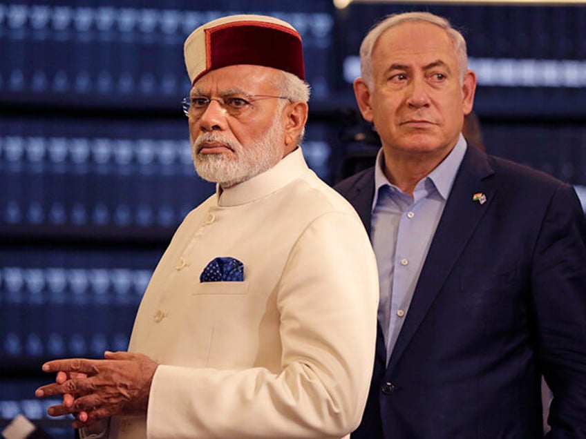 Indian Prime Minister Narendra Modi, left, accompanied by Israeli Prime Minister Benjamin