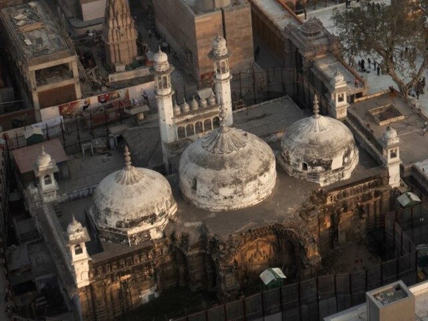 An Aerial view shows Gyanvapi mosque on the banks of the river Ganges in Varanasi, India, Dec. 12, 2021. The 17th-century mosque in Varanasi, Hinduism's holiest city, has emerged as the latest flashpoint between Hindus and Muslims. A court case will decide whether the site would be given to Hindus, …