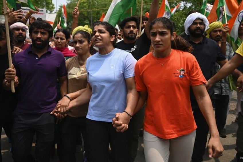 Bajrang Punia (left) joined wrestlers Vinesh Phogat, Sakshi Malik and Sangeeta Phogat on a